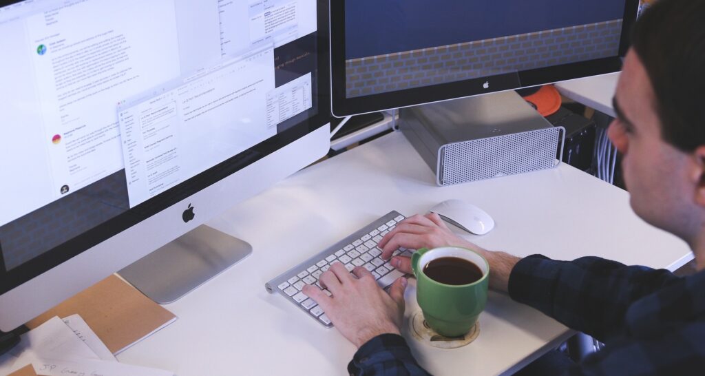 A marketer doing work at their desk